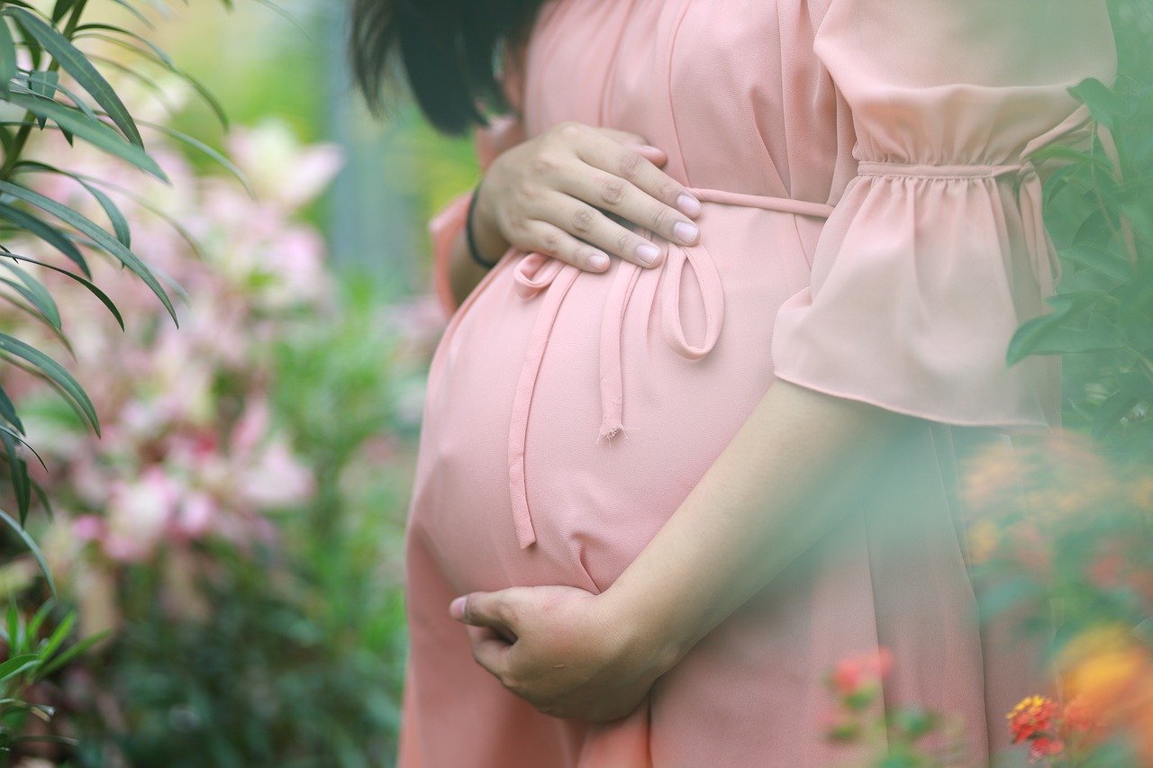 Pregnant woman in pink dress